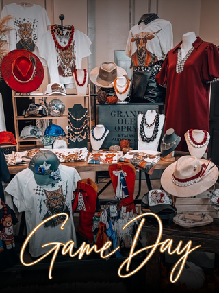 Jayden Layne Game Day display with graphic tees, hats, and accessories