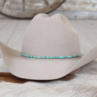 Genuine turquoise stone hat band on a cotton cord with leather ties on a tan cowboy hat, photo 1