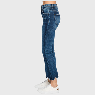 Dark wash high rise crop bootcut jeans, close-up of distressed hem