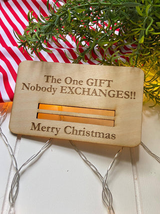 Laser engraved wooden Christmas money holder that says The One Gift Nobody Exchanges