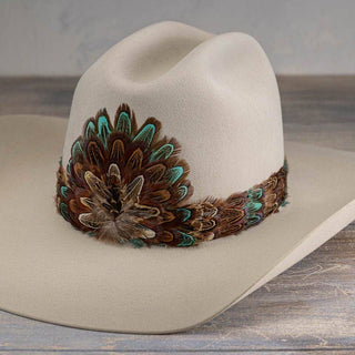 Western Feather Hat Band - Canyon on a tan western hat, size-inclusive Jayden Layne boutique with boho and denim style elements.
