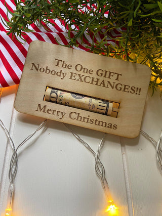 Laser engraved wooden Christmas money holder that says The One Gift Nobody Exchanges