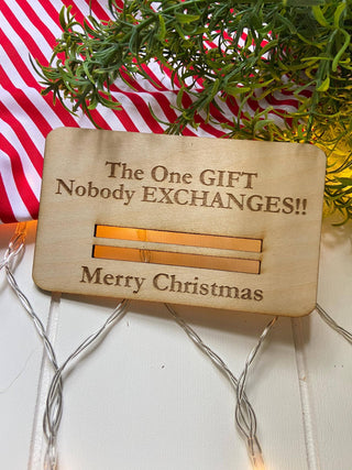 Laser engraved wooden Christmas money holder that says The One Gift Nobody Exchanges