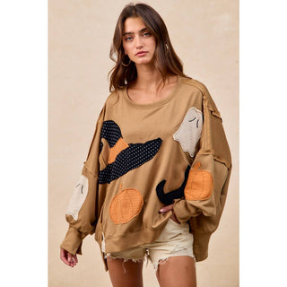 Camel Halloween patchwork sweatshirt, close-up of appliqué detail