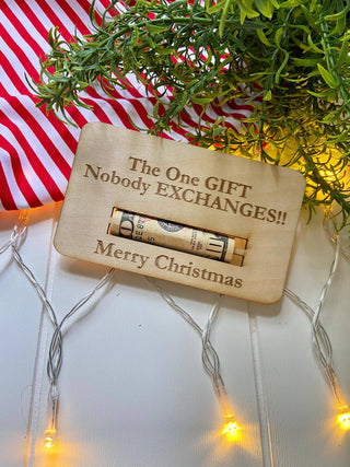Laser engraved wooden Christmas money holder that says The One Gift Nobody Exchanges