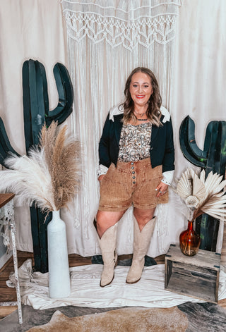 Woman wearing Saddle conch button shorts styled western with denim and boho from Jayden Layne size-inclusive boutique