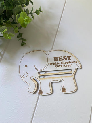 Empty wooden elephant money holder showing the slot for a rolled bill on a white background