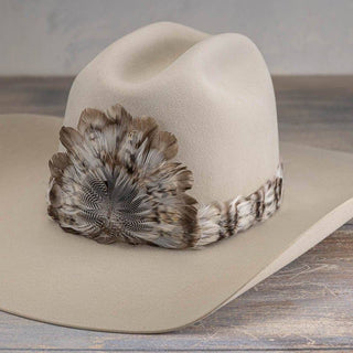 Osprey western feather hat band with neutral feather crest on a cream cowboy hat, photo 1