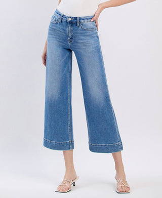 Medium wash high rise crop wide leg jeans, back view