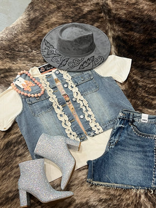Light wash denim ruffle vest with ivory ruffle trim