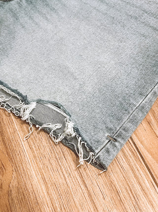 90's Mid Rise Dad Shorts corner showing distressed frayed hem on denim, Jayden Layne size-inclusive boutique western style