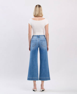 Medium wash high rise crop wide leg jeans, cropped hem detail