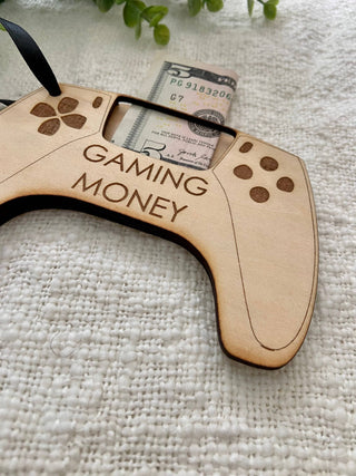 Close-up of the engraved Gaming Money controller money holder and slot