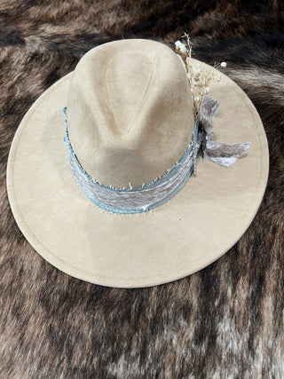 Adjustable tan felt flat brim hat back view with custom frayed denim hat band and fabric bow tails