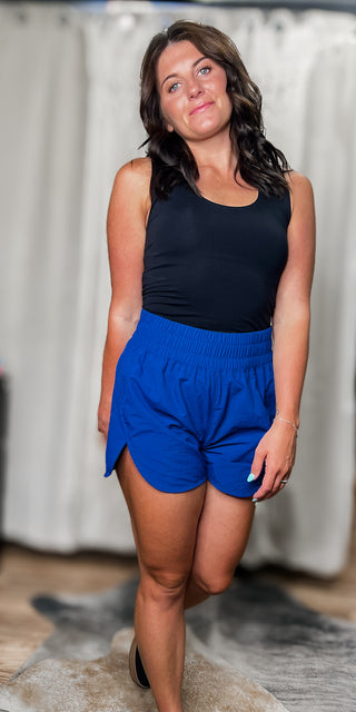 Navy windbreaker smocked shorts