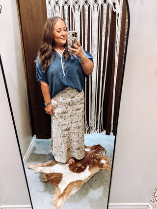 Side view of flowy A-line satin maxi skirt