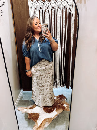 Woman wearing long satin western maxi skirt