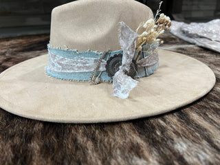 One of a kind tan felt flat brim cowgirl hat with frayed denim and print fabric band, concho and dried florals, side view