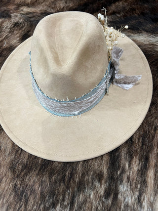 Tan felt flat brim western hat back view showing frayed light-wash denim and print fabric band
