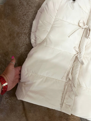 White flutter sleeve bow tie puffer vest