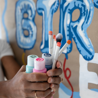 Happy Birthday foil balloon banner being painted by number