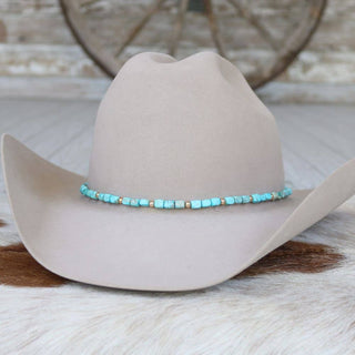 Chunky turquoise stone hat band Ellis with gold spacer beads on a tan cowboy hat, photo 1