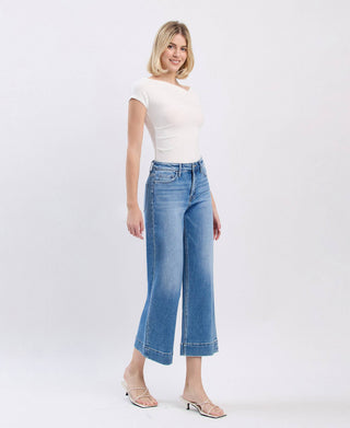 Medium wash high rise crop wide leg jeans, waistband detail
