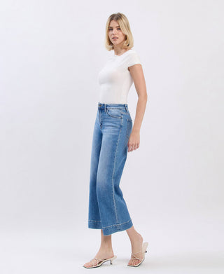Medium wash high rise crop wide leg jeans, full length view